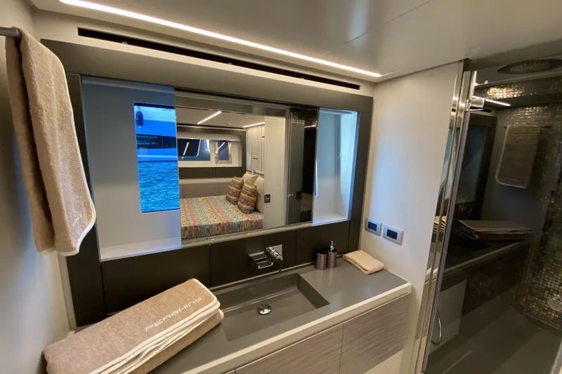  Yacht Photos Pics Luxurious bathroom interior of 2023 Pershing 6X yacht with modern design and elegant fixtures.