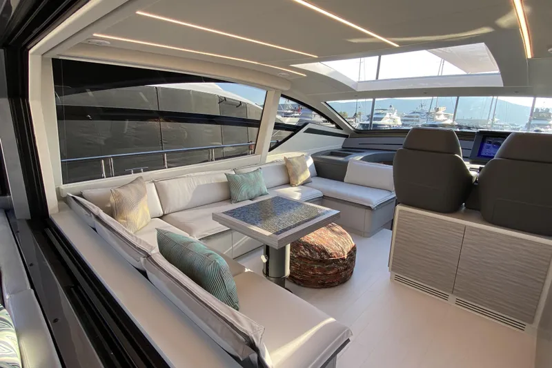  Yacht Photos Pics Luxurious interior of 2023 Pershing 6X yacht with modern seating and elegant design.