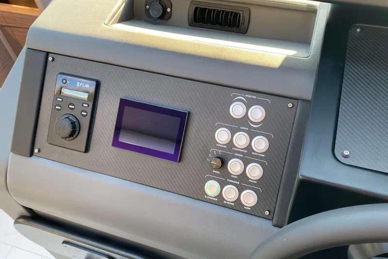  Yacht Photos Pics Control panel of 2023 Pershing 6X yacht with buttons and display screen.