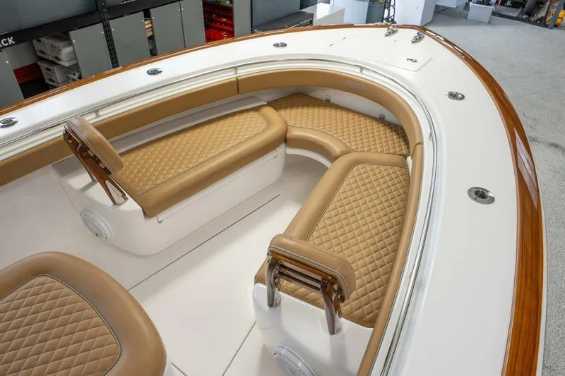 T/t Silvertime Yacht Photos Pics 2023 Valhalla Boatworks V-33 interior with tan quilted seating and sleek design.