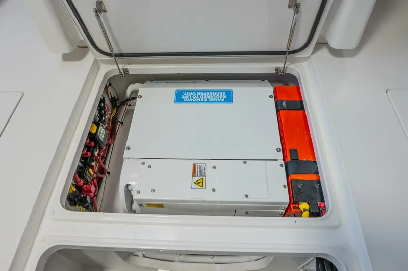T/t Silvertime Yacht Photos Pics 2023 Valhalla V-33 boat electrical panel and storage compartment.