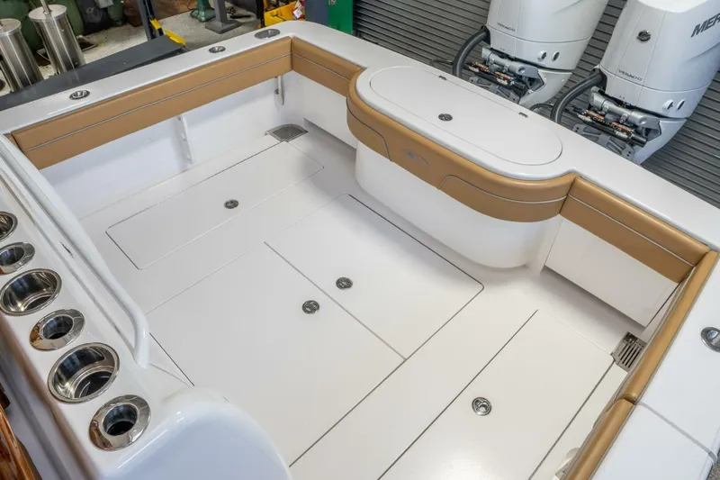 T/t Silvertime Yacht Photos Pics 2023 Valhalla Boatworks V-33 interior with tan seating and dual Mercury engines.