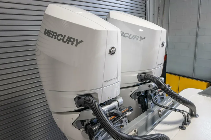T/t Silvertime Yacht Photos Pics Twin Mercury Verado engines on 2023 Valhalla Boatworks V-33, in a garage setting.