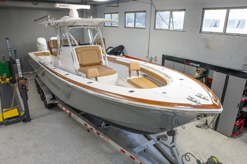 T/t Silvertime Yacht Photos Pics 2023 Valhalla Boatworks V-33 in garage, featuring sleek design and modern amenities.