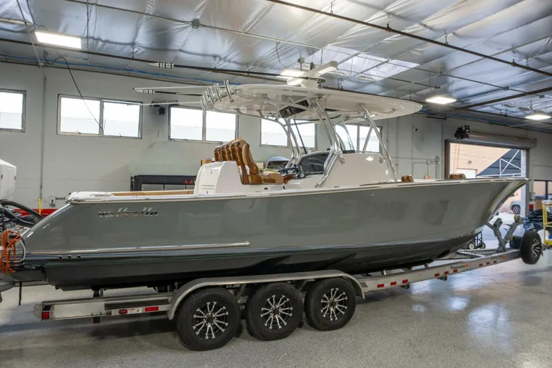 T/t Silvertime Yacht Photos Pics 2023 Valhalla Boatworks V-33 on trailer in indoor facility.