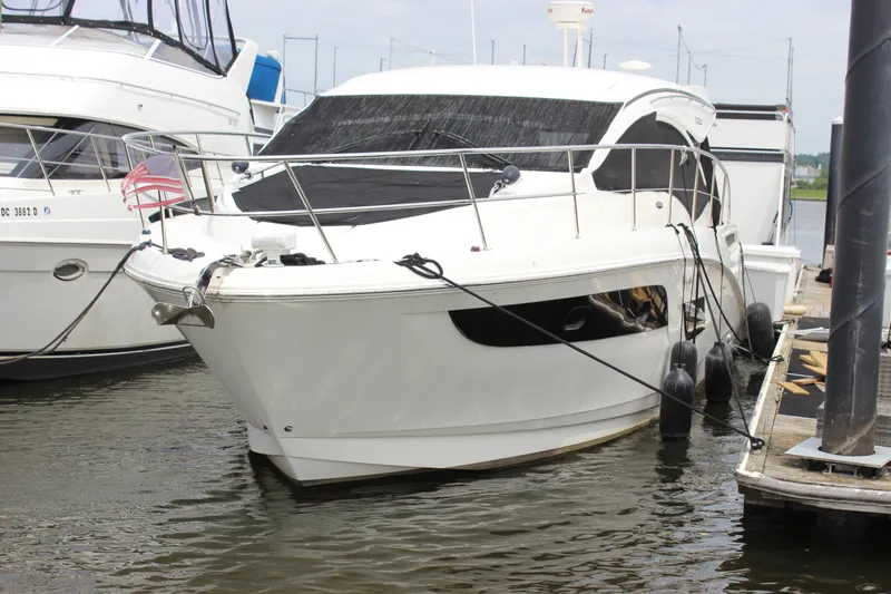  Yacht Photos Pics 2017 Sea Ray Sundancer 400 yacht docked at marina, featuring sleek white design.