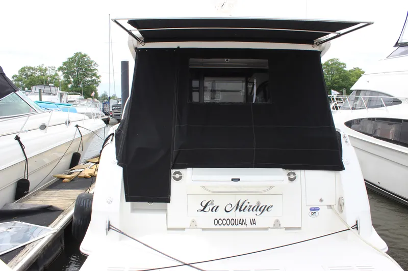  Yacht Photos Pics 2017 Sea Ray Sundancer 400 docked, rear view with black canopy, named "La Mirage."