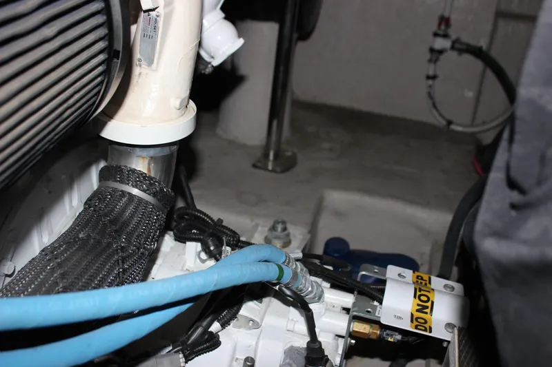  Yacht Photos Pics Engine compartment of 2017 Sea Ray Sundancer 400 with visible hoses and components.