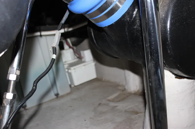  Yacht Photos Pics Engine compartment of a 2017 Sea Ray Sundancer 400 boat, showing hoses and wiring.