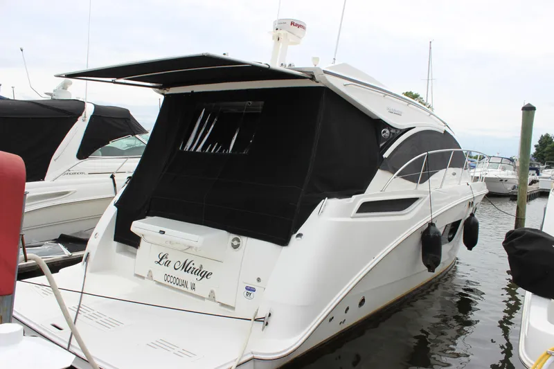  Yacht Photos Pics 2017 Sea Ray Sundancer 400 yacht docked with black canopy and sleek design.