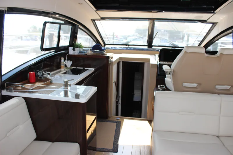  Yacht Photos Pics Interior of 2017 Sea Ray Sundancer 400 yacht with modern kitchen and seating area.