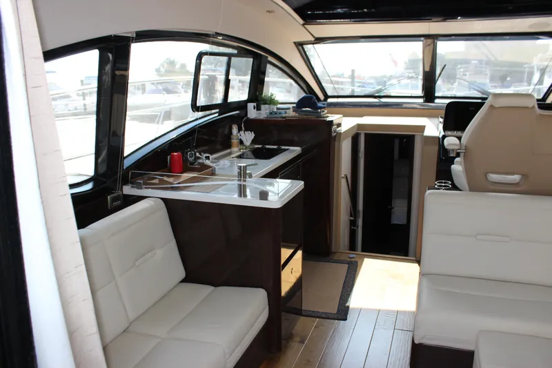  Yacht Photos Pics Interior of 2017 Sea Ray Sundancer 400 yacht with modern seating and kitchenette.