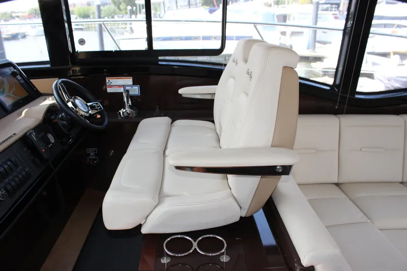  Yacht Photos Pics Luxurious interior of 2017 Sea Ray Sundancer 400 yacht with plush seating and modern helm.