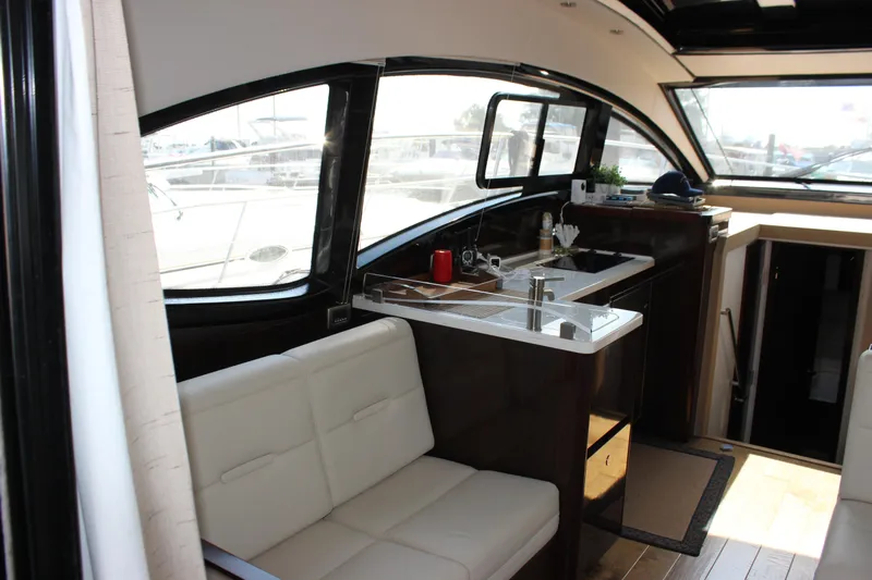  Yacht Photos Pics 2017 Sea Ray Sundancer 400 interior with modern kitchen and seating area.