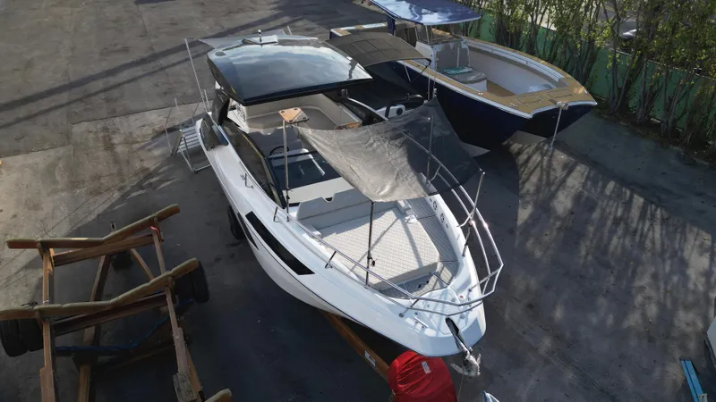  Yacht Photos Pics 2023 NX Boats 34 Sport Coupe docked, aerial view.
