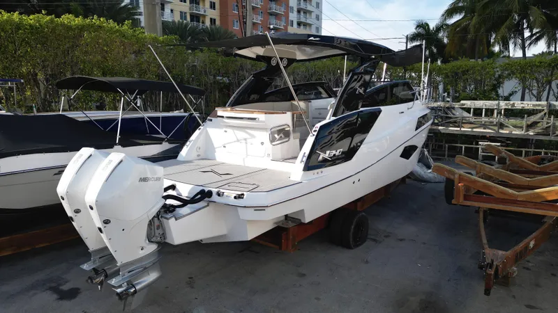  Yacht Photos Pics 2023 NX Boats 34 Sport Coupe, docked, rear view.