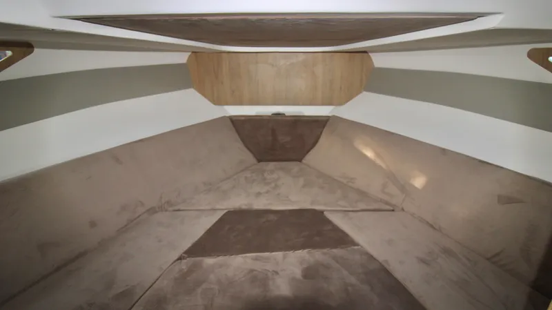  Yacht Photos Pics Interior cabin of 2023 NX Boats 34 Sport Coupe with beige upholstery.