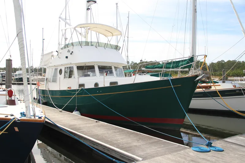 Adria Yacht Photos Pics Willard Marine 40 Flybridge Sedan Trawler, 2000, docked at marina.