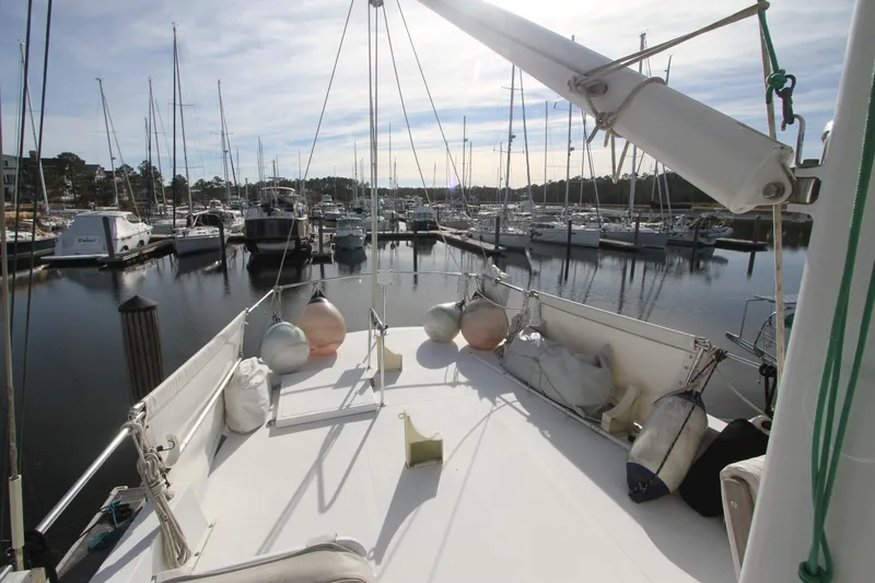 Adria Yacht Photos Pics Willard Marine 40 Flybridge Sedan Trawler, 2000, docked in a marina with other boats.