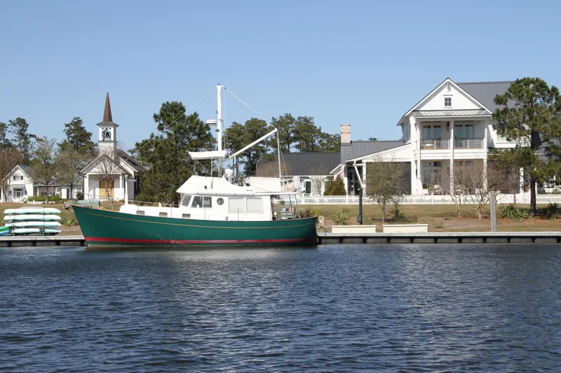 Adria Yacht Photos Pics Willard Marine 40 Flybridge Sedan Trawler docked near waterfront homes, 2000 model.