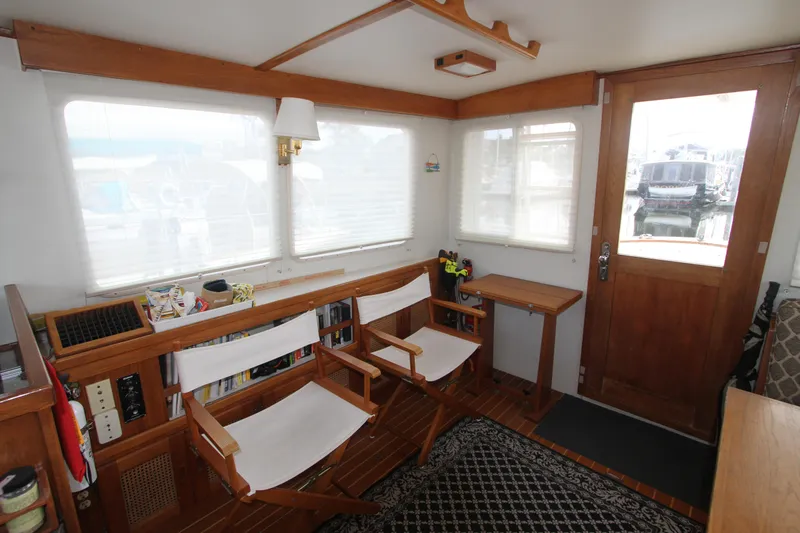 Adria Yacht Photos Pics Interior of 2000 Willard Marine 40 Flybridge Sedan Trawler with wooden decor and seating.