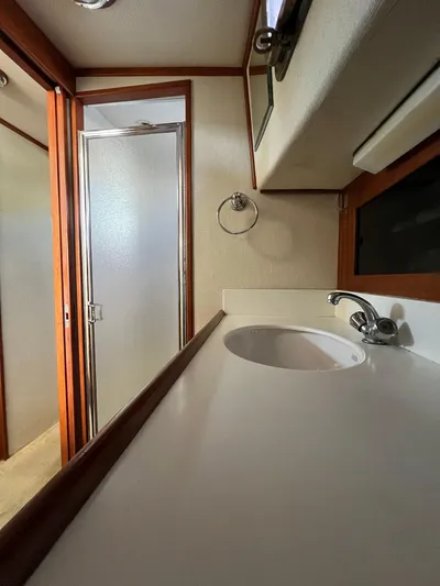 Adria Yacht Photos Pics Interior of 2000 Willard Marine 40 Flybridge Sedan Trawler bathroom with sink and shower.
