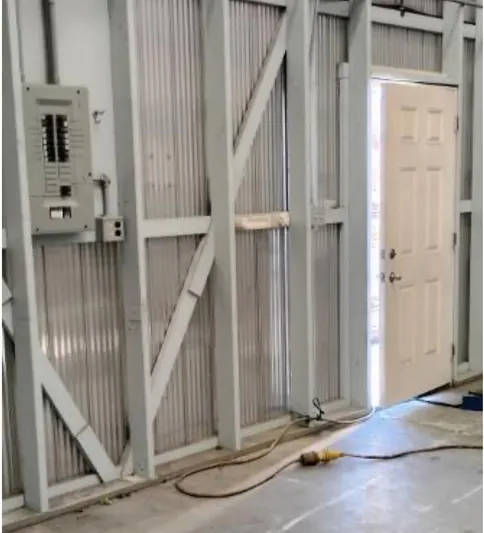  Yacht Photos Pics Interior of a 2017 custom boathouse with open door and electrical panel.