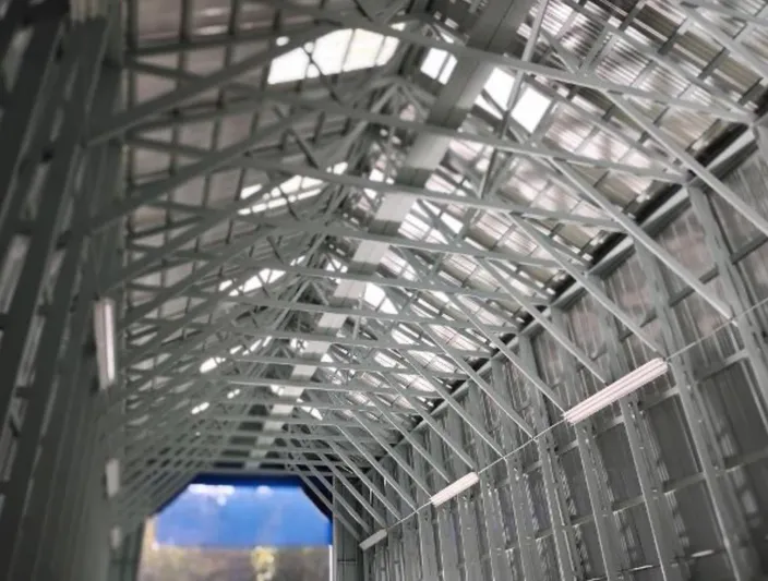  Yacht Photos Pics Interior view of a custom 2017 boathouse with metal trusses and open ceiling.