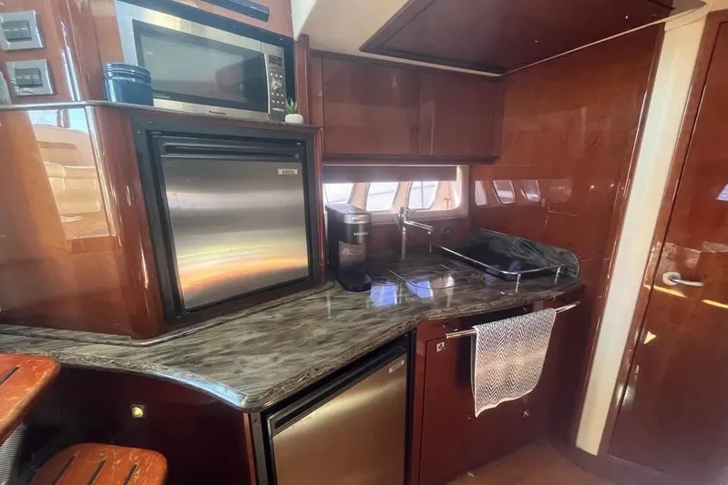  Yacht Photos Pics Luxurious 2012 Sea Ray 390 Sundancer yacht kitchen with modern appliances and sleek design.