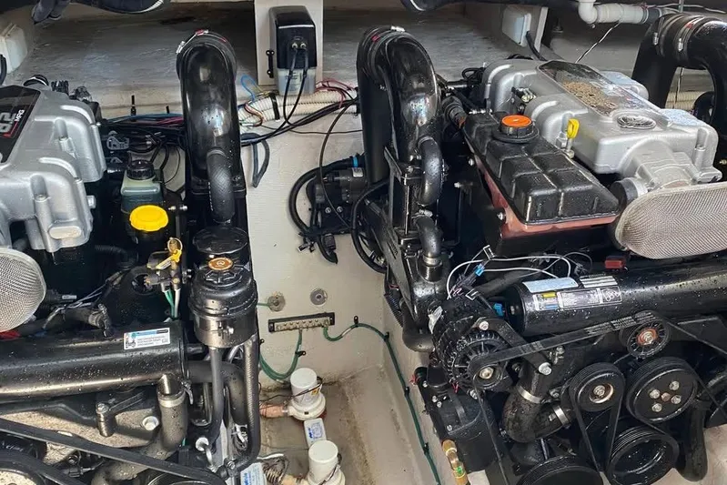  Yacht Photos Pics Engine compartment of a 2012 Sea Ray 390 Sundancer boat, showcasing dual engines.