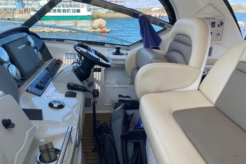  Yacht Photos Pics Interior of 2012 Sea Ray 390 Sundancer boat with helm and seating area.