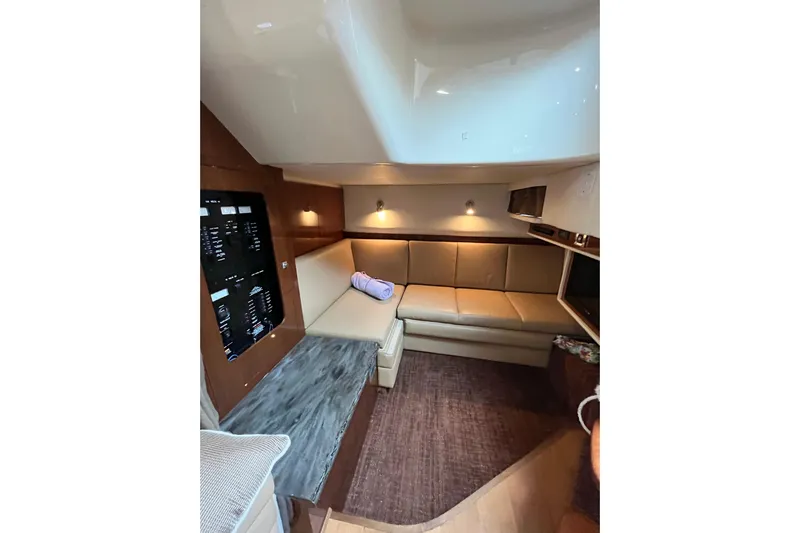  Yacht Photos Pics Luxurious interior of 2012 Sea Ray 390 Sundancer yacht with cozy seating area.