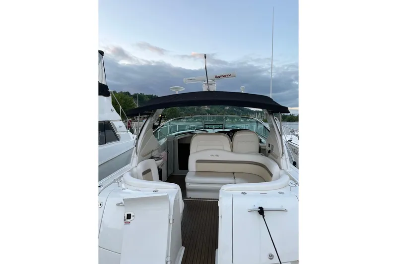  Yacht Photos Pics 2012 Sea Ray 390 Sundancer yacht with spacious seating and sleek design at a marina.