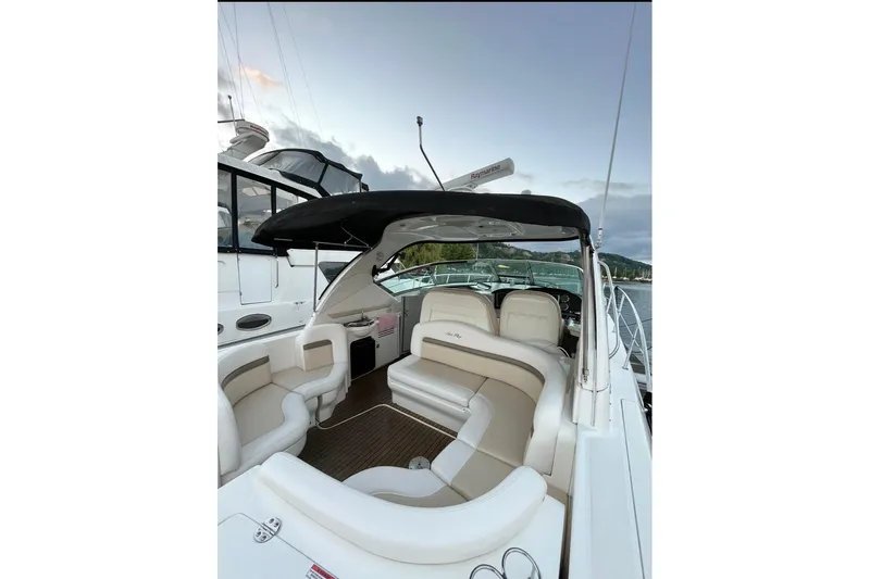  Yacht Photos Pics 2012 Sea Ray 390 Sundancer yacht interior with seating and canopy, docked by the water.