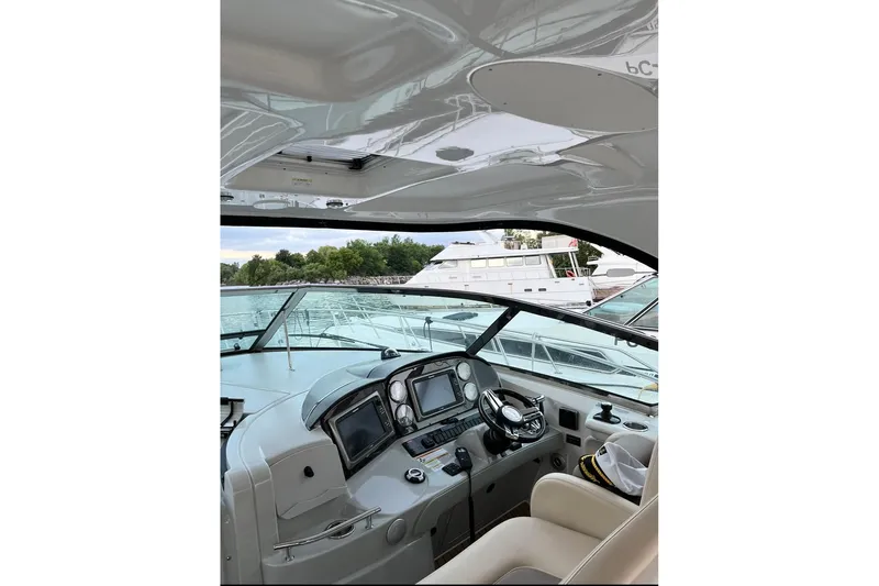  Yacht Photos Pics Cockpit view of 2012 Sea Ray 390 Sundancer yacht, featuring modern navigation equipment.