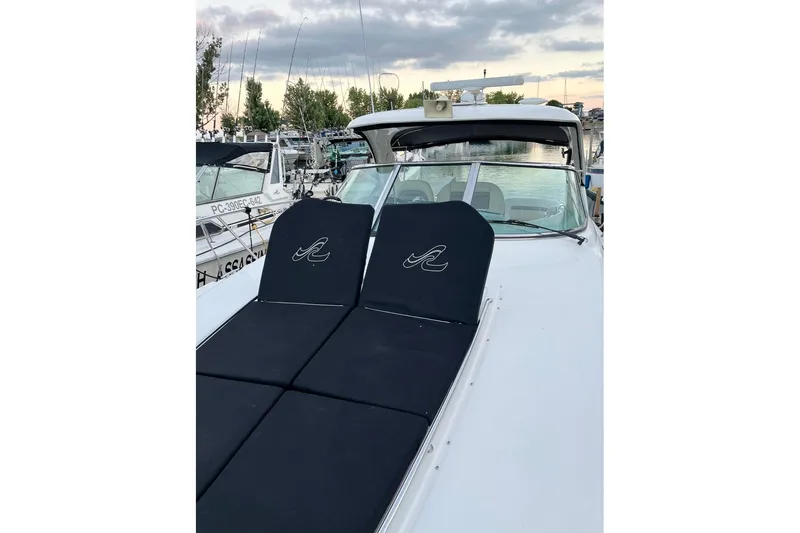  Yacht Photos Pics 2012 Sea Ray 390 Sundancer yacht with black sun pads, docked at marina.