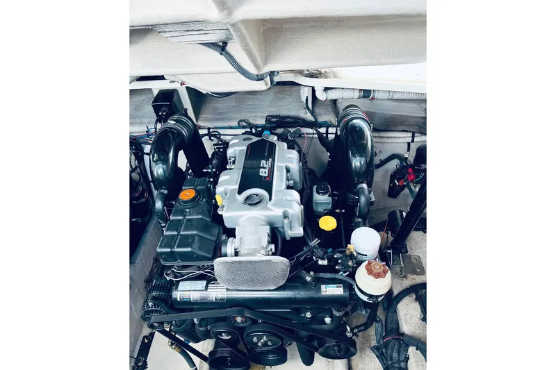  Yacht Photos Pics Engine compartment of 2012 Sea Ray 390 Sundancer boat, showcasing powerful machinery.