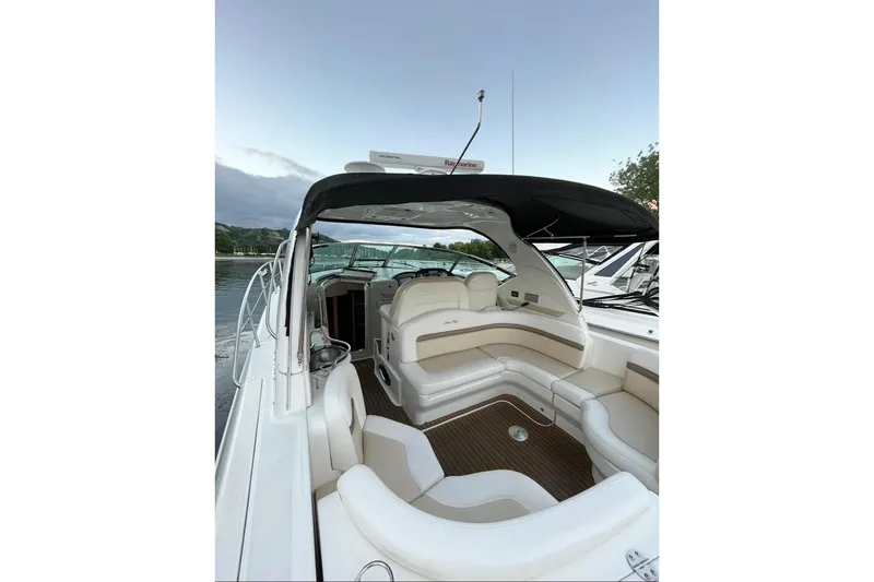  Yacht Photos Pics 2012 Sea Ray 390 Sundancer yacht interior with white seating and canopy on calm water.