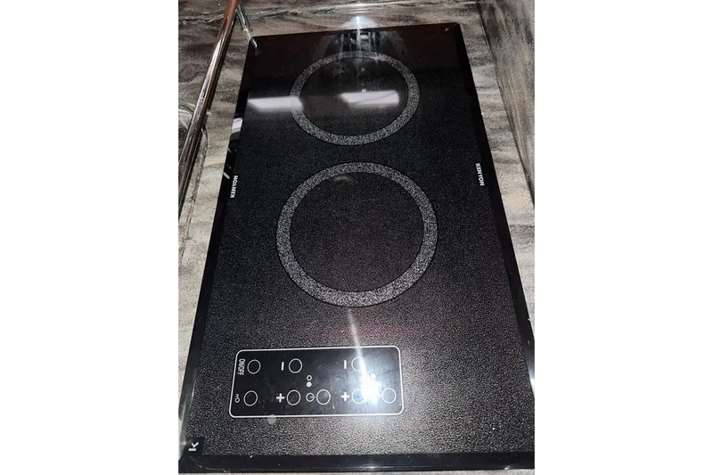  Yacht Photos Pics Ceramic cooktop on 2012 Sea Ray 390 Sundancer yacht, featuring dual burners and touch controls.