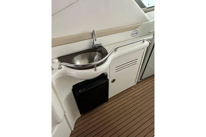  Yacht Photos Pics 2012 Sea Ray 390 Sundancer yacht interior with sink and mini fridge.