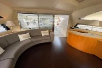 Luxurious interior of a 2005 Pershing 76 yacht with elegant seating and modern design.