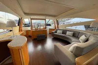 Luxurious interior of a 2005 Pershing 76 yacht with elegant seating and modern design.