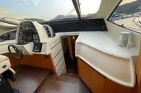 Interior view of a 2005 Pershing 76 yacht cockpit with modern controls and navigation equipment.