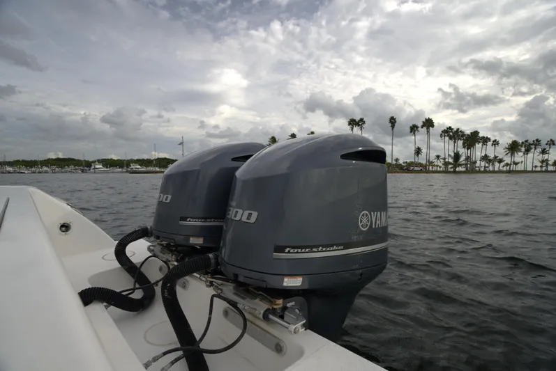  Yacht Photos Pics Invincible 33 boat with twin Yamaha outboard motors on a cloudy day.