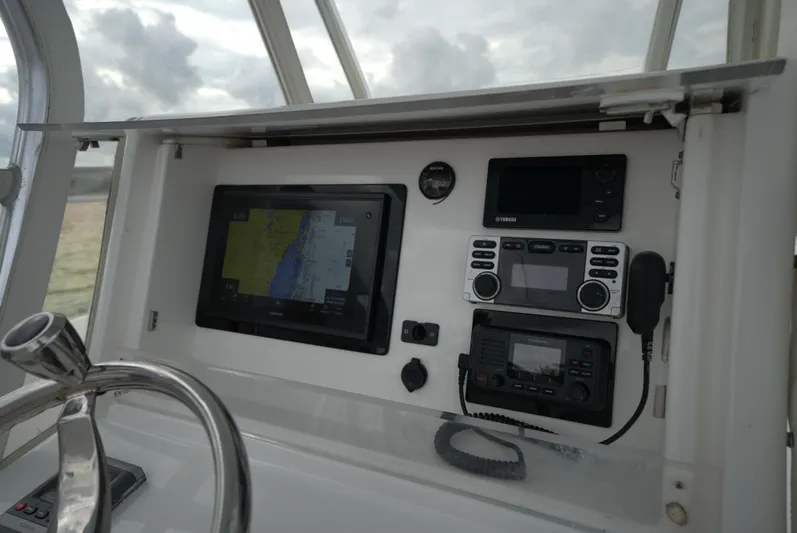 Yacht Photos Pics Boat dashboard with navigation and communication equipment, Invincible 33, 2012 model.