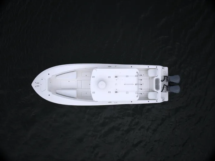  Yacht Photos Pics Aerial view of 2012 Invincible 33 boat on dark water.