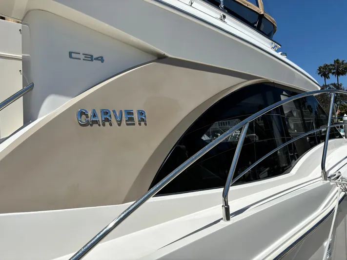  Yacht Photos Pics 2014 Carver C34 yacht side view with sleek design and chrome accents.