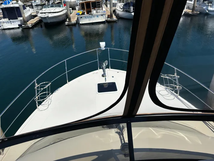  Yacht Photos Pics 2014 Carver C34 yacht bow view in marina, surrounded by docked boats.