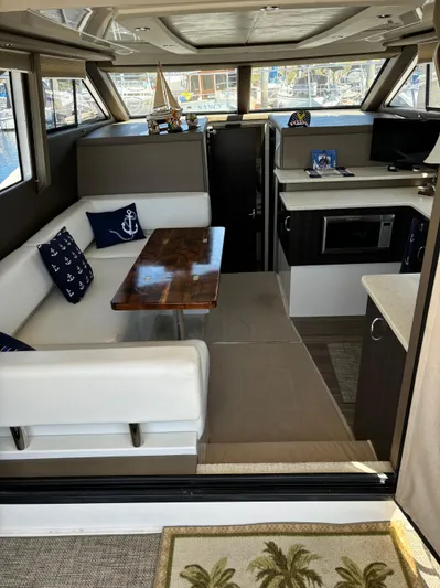  Yacht Photos Pics Interior of 2014 Carver C34 yacht with modern seating and kitchen area.