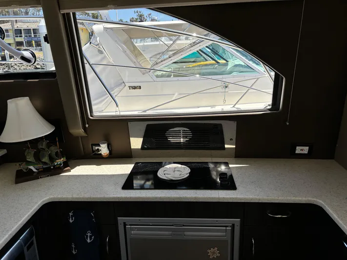  Yacht Photos Pics Interior view of 2014 Carver C34 yacht kitchen with window and countertop.